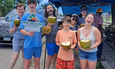 Family enjoying Coconut Water with Just Because Tours