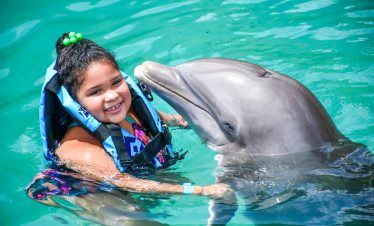 Girl swimming with Dolphin